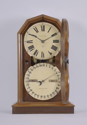 Seth Thomas Clock Co., Thomaston, Conn., "Parlor Calendar No. 5" shelf clock with a spring driven 8 day time and strike movement and a R. T. Andrews patented perpetual calendar mechanism in a walnut case.