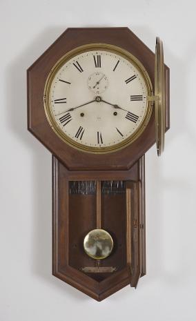 Seth Thomas Clock Co., Thomaston, Conn., "World" long drop octagon wall clock with a spring driven 8 day time and strike movement in a mahogany case.