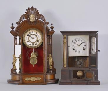 Clocks- 2 (Two): (1) New Haven Clock Co., New Haven, Conn., "Occidental" shelf clock with a spring driven 8 day time and half hour srike movement in a walnut case with mirror sides. (2) Atkins Clock Co., Bristol, Conn., "London" shelf clock with a spring driven 8 day time and strike movement in a rosewood veneered case.