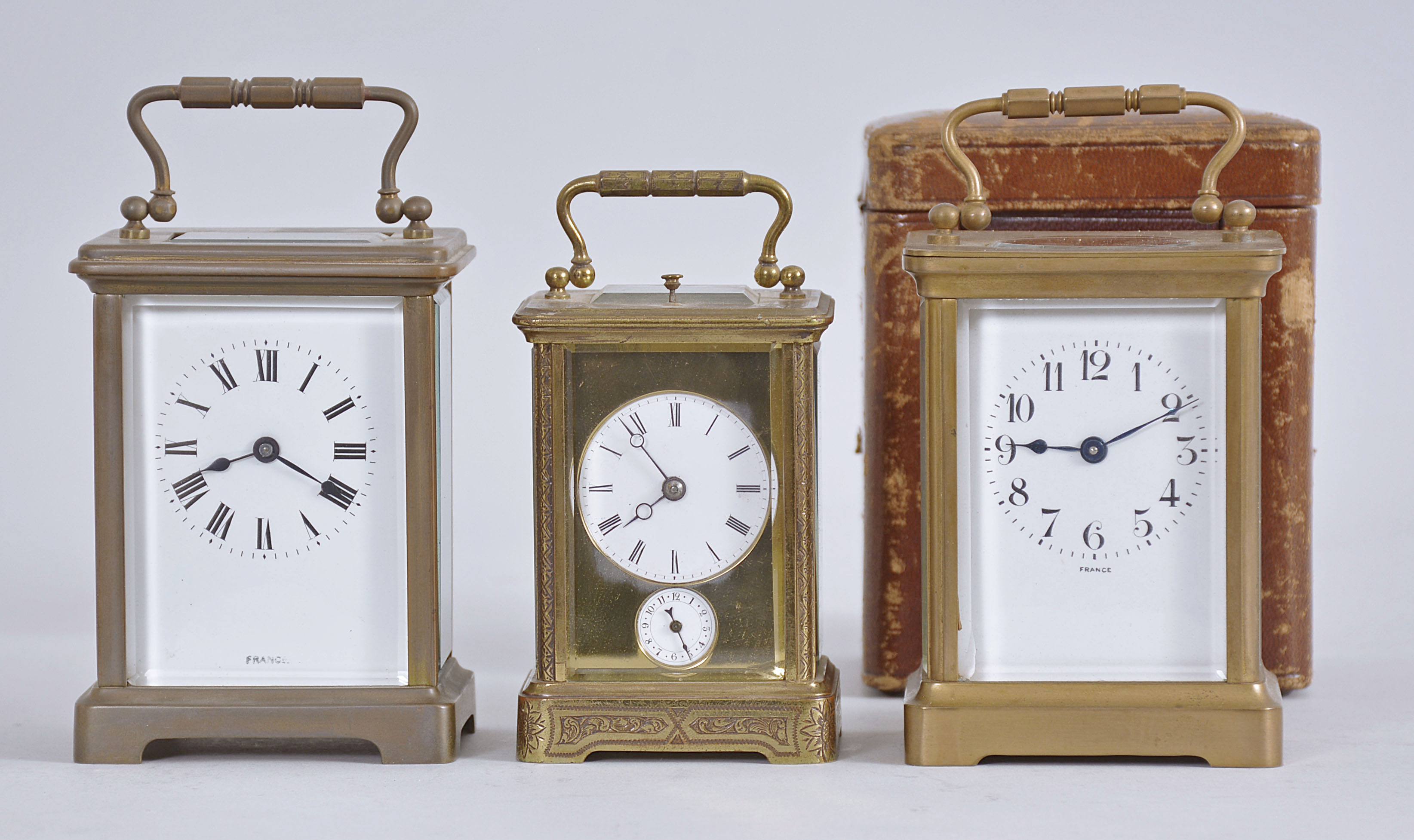 Three French carriage clocks, one with alarm and repeat