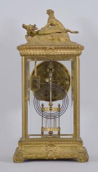 Seth Thomas Clock Co., Thomaston, Conn., "Empire No. 14" crystal regulator, 8 day, time and strike, spring driven brass movement in a gilt case with cast hunting scene at top, beveled glasses on all four sides, arabic numeral white enamel dial, blued steel hands, with simulated mercury pendulum.