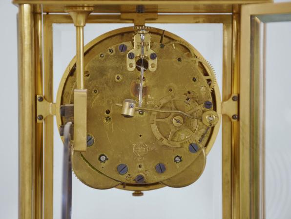 Seth Thomas Clock Co., Thomaston, Conn., "Empire No. 14" crystal regulator, 8 day, time and strike, spring driven brass movement in a gilt case with cast hunting scene at top, beveled glasses on all four sides, arabic numeral white enamel dial, blued steel hands, with simulated mercury pendulum.