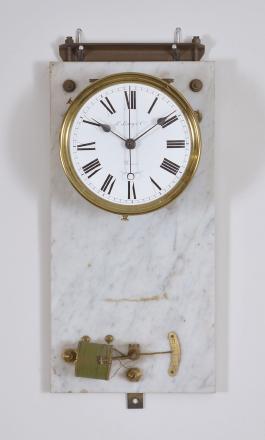 Clock parts, including an Electrique Brillie hanging clock with molded wooden case and marble backboard, the white enamel dial signed "L. Leroy & Co., a Paris", a "Wizard" coin operated trade stimulator in a black mantel case, and a crystal regulator style case for an unknown electric movement