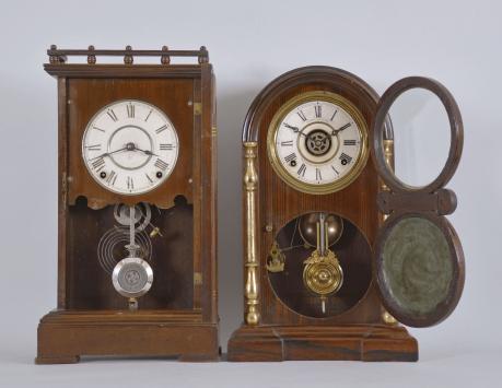 Clocks- 2 (Two): (1) Seth Thomas Clock Co., Thomaston, Conn., "Omaha" shelf clock with a spring driven 8 day time and strike (cathedral gong) lyre movement in a walnut case with gilt banding, c1888. (2) E. Ingraham & Co., Bristol, Conn., "Venetian No. 2, Extra" shelf clock with a spring driven 8 day time, strike and alarm movement in a rosewood veneered case with gilt columns and a cut glass mirror in the door, c1881.