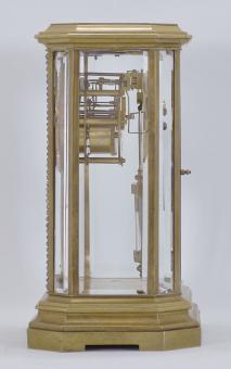 S. Marti, Paris, France, crystal regulator, 8 day, time and strike, spring driven pendule de Paris movement in a brass case with glazed canted corners, molded base and cornice, door and bezels outlined with brilliants, arabic numeral white enamel dial with polychrome floral garlands inside the numbers, blued steel hands and two-vial compensating pendulum.