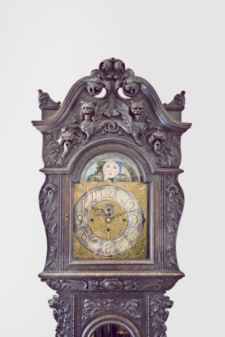J.J. Elliott, London, England, monumental tall clock, 8 day, time, strike and chime movement playing Westminster or Whittington quarters on nine tubular bells, in an extremely ornate, carved oak case featuring gargoyles and other mythical creatures. The brass dial is nicely shaped and has raised silver chapter ring and subsidiary seconds, all surrounded by ornately cast brass trim and spandrels with cast brass dial center
