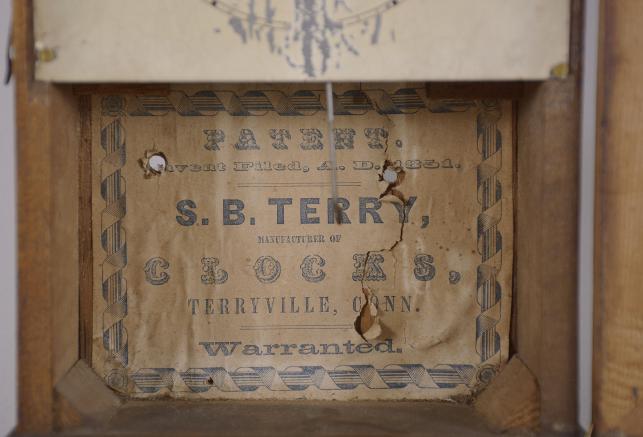 S. B. Terry. Plymouth, Conn., 30 hour, spring driven brass movement cottage or cigar box shelf clock.