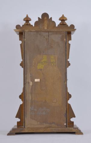 Waterbury Clock Co., Waterbury, Conn., "Calendar No. 40" shelf clock with a spring driven 8 day time and strike movement and an Albert F. Wells patented perpetual calendar mechanism in a walnut case.