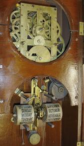 Waterbury Clock Co., Waterbury, Conn., "Calendar No. 40" shelf clock with a spring driven 8 day time and strike movement and an Albert F. Wells patented perpetual calendar mechanism in a walnut case.