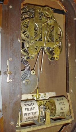 Seth Thomas Clock Co., Thomaston, Conn., "Parlor Calendar No. 4" with a spring driven 8 day time and strike movement with a R. T. Andrews patented perpetual calendar mechanism in a walnut case.