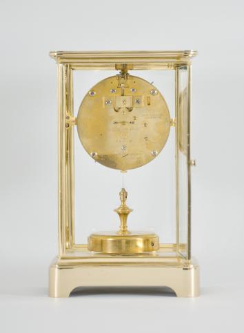 C. Grivolas and Cie, Paris, France, "Pendule 400 Jours" 400-day clock, year running, time only, spring driven movement with torsion pendulum in brass and glass crystal regulator case, arabic numeral white enamel dial, gilt hands.