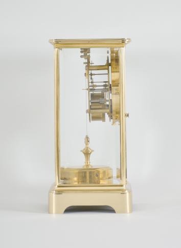 C. Grivolas and Cie, Paris, France, "Pendule 400 Jours" 400-day clock, year running, time only, spring driven movement with torsion pendulum in brass and glass crystal regulator case, arabic numeral white enamel dial, gilt hands.