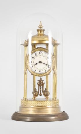 Kienzle GmbH, Schwenningen, Germany, Louvre style 400-day clock, year running, time only, spring driven torsion pendulum movement in a polished brass case with six fluted columns, arabic numeral arcaded enamel dial, all under a glass dome.