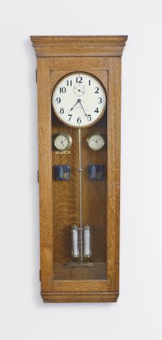 International Time Recording Co., Endicott, NY, self winding master wall clock, weight driven, time only movement with two vial mercury pendulum in an oak case with subsidiary dials for London and New York, with painted metal dial