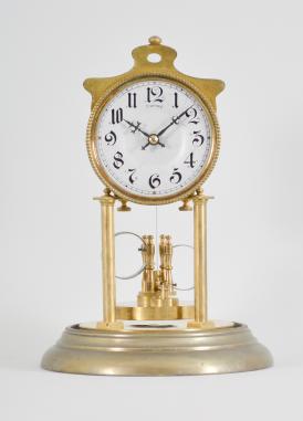 Attributed to Andreas Huber, Munich, Germany, "Yearlong" 400-day or anniversary clock, year running, time only, spring driven brass movement with temperature compensating Huber twin-loop bimetallic torsion pendulum, silver colored dial with black arabic numerals, and black steel hands, all under a glass dome.