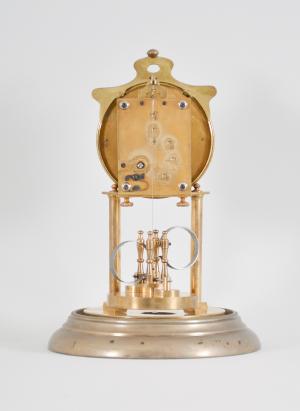 Attributed to Andreas Huber, Munich, Germany, "Yearlong" 400-day or anniversary clock, year running, time only, spring driven brass movement with temperature compensating Huber twin-loop bimetallic torsion pendulum, silver colored dial with black arabic numerals, and black steel hands, all under a glass dome.