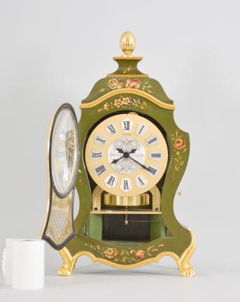 Jaeger-LeCoultre, Switzerland, "Atmos Neuchateloise" clock, caliber 528 jeweled movement, gilt torsion pendulum in a Neuchateloise green painted case with painted floral designs, brass dial with applied roman cartouche numerals, and black metal hands.