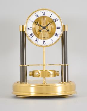 Jaeger-LeCoutre, Switzerland, "Atmos 150th Anniversary" mantel clock, 14 jewel, caliber 540 movement with torsion pendulum in a gilt case and base with glass dome, roman numeral white painted dial, and black painted hands.