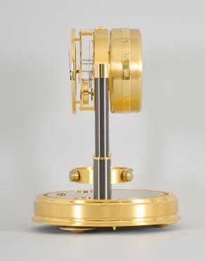 Jaeger-LeCoutre, Switzerland, "Atmos 150th Anniversary" mantel clock, 14 jewel, caliber 540 movement with torsion pendulum in a gilt case and base with glass dome, roman numeral white painted dial, and black painted hands.