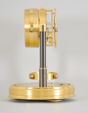 Jaeger-LeCoutre, Switzerland, "Atmos 150th Anniversary" mantel clock, 14 jewel, caliber 540 movement with torsion pendulum in a gilt case and base with glass dome, roman numeral white painted dial, and black painted hands.