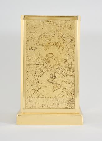 Jaeger-LeCoultre, Switzerland, "Atmos" perpetual clock, caliber 526-5, jeweled movement with torsion pendulum, round white painted dial with four applied gilt arabic numerals and arrow markers, gilt hands, all contained in a glazed rectangular case decorated on the inside with gilt maps showing antiquated representations of the constellations.