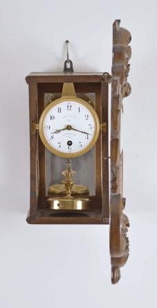 C. Grivolas and Cie, Paris, France, "Pendule 400 Jours" hanging 400-day clock, year running, time only, spring driven movement with torsion pendulum in carved walnut rococo style case with beveled glasses on the front and sides, arabic numeral white enamel dial with retailer "Au Roy D