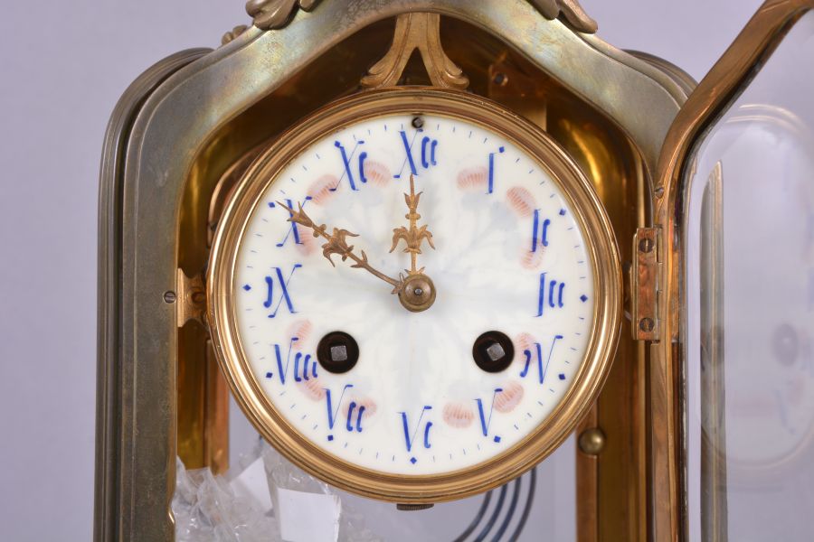 C. Grivolas and Cie, Paris, France, "Pendule 400 Jours" hanging 400-day clock, year running, time only, spring driven movement with torsion pendulum in carved walnut rococo style case with beveled glasses on the front and sides, arabic numeral white enamel dial with retailer "Au Roy D