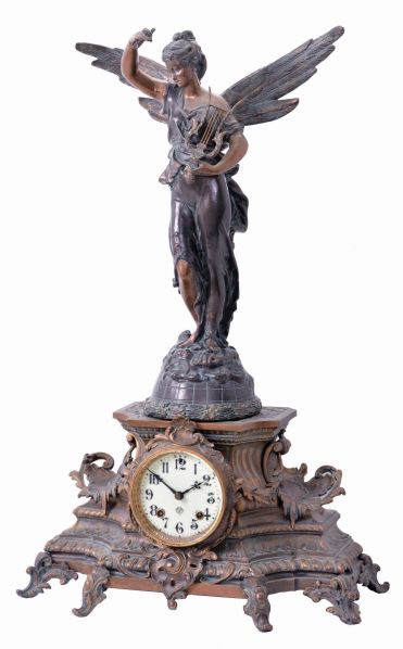 Ansonia Clock Co., New York, "Undine" 8 day, time and strike, spring driven brass movement mantel clock with a figure of "Gloria" on top.