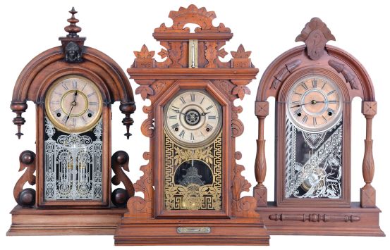 Clocks- 3 (Three): (1) Ansonia Clock Co., New York, "Parisian" shelf clock with a spring driven, 8 day, time and strike movement in a walnut case, c1880; (2) William L. Gilbert Clock Co., Winsted, Conn., "Texas" shelf clock with a spring driven, 8 day, time and strike movement in a walnut case, c1881. (3) E. Ingraham & Co., Bristol, Conn., premium model shelf clock with a spring driven, 8 day time, strike & alarm movement in a walnut case with a thermometer & level, c1880.