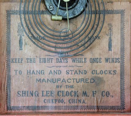 Clocks- 3 (Three): (1) Shing Lee Mfg. Co., Chefoo, China, 8 day, time and strike, spring brass movement round top shelf clock, c1910; (2) F. Kroeber Clock Co., New York, "Cabinet No. 2", 8 day, time and strike, spring brass movement wood case shelf clock, c1881 (3) Unknown, possibly by the American Clock Co., New York, 30 hour, time and alarm spring brass movement iron front shelf clock, c1865