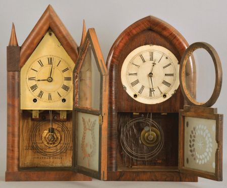 Clocks- 2 (Two): (1) Jonathan Frost, Reading, Mass. (by Brewster & Ingrahams, Bristol, Conn. and sold by Frost), 8 day, time and strike, spring brass movement Sharp Gothic or Steeple clock; (2) Brewster & Ingrahams, Bristol, Conn., 8 day, time and strike, spring brass movement Round Gothic or Beehive shelf clock.