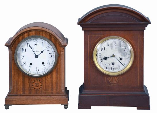 Clocks- 2 (Two) Mahogany Shelf: (1) Junghans, Wurttemberg, Germany, Westminster chime shelf clock, 8 day, spring driven A07 movement in a mahogany case with inlay and silvered dial with Roman numerals; (2) Seth Thomas Clock Co., Thomaston, Conn., "Tory" cabinet clock, 8 day, spring driven round movement in a mahogany case with white enamel dial, shaded marquetry, all on brass ball feet, c1913.