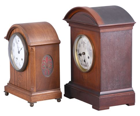 Clocks- 2 (Two) Mahogany Shelf: (1) Junghans, Wurttemberg, Germany, Westminster chime shelf clock, 8 day, spring driven A07 movement in a mahogany case with inlay and silvered dial with Roman numerals; (2) Seth Thomas Clock Co., Thomaston, Conn., "Tory" cabinet clock, 8 day, spring driven round movement in a mahogany case with white enamel dial, shaded marquetry, all on brass ball feet, c1913.