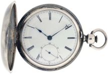 American Waltham Watch Co.,Waltham, Mass., model 1857 "P.S. Bartlett" for T. Bradbury, Paterson, NJ, 18 size, 11 jewels, key wind and set gilt plate movement with lever escapement in a coin silver, engraved hunting case, with Roman numeral white enamel dial, blued steel hands, serial #1869, c1858.