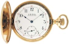 American Waltham Watch Co.,Waltham, Mass., "American Watch Co." model 1888, 16 size, 21 jewels, stem wind and set, adjusted, ornately damascened nickel plate movement with lever escapement, cut bimetallic balance, gold jewel settings, gold timing screws, gold wheel train and Fogg tadpole micrometric regulator in a rose gold filled, engine turned hunting case, and Arabic numeral, outer red 5-minute markers, single sunk "A.W.W.Co." white enamel dial, blued steel spade hands, serial #7003029, c1900.