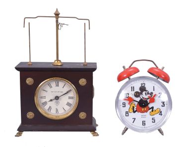 Clocks- 2 (Two) Novelty: (1) Horolovar Co., Bronxville, New York reproduction "Ignatz" flying pendulum novelty clock, reproduction of the model made by the New Haven Clock Co., c1970; (2) Reveils Bayard, France, "Mickey" alarm clock with external bells and rocking head Mickey Mouse figure, c1977.