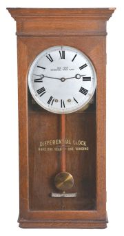 Differential Power Clock Co., Chicago, "Year Running" wall clock with unique patented double spring movement in a robust oak case, and with original front tablet identifying the clock.