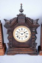 Clocks- 4 (Four): (1) Ansonia TURKEY in golden oak, embossed dial, 8 day; (2) Ansonia TORONTO in oak and with original crazed finish; (3) German copy of octagon top cottage clock, unknown duration, and (4) a German "Alt Deutsch" style shelf clock with a copy of the Ansonia 8 day movement.