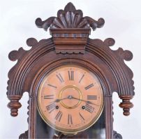 Ansonia Clock Co., New York, "Queen Isabella", 8 day, time and strike in a pressed and carved oak wall case.
