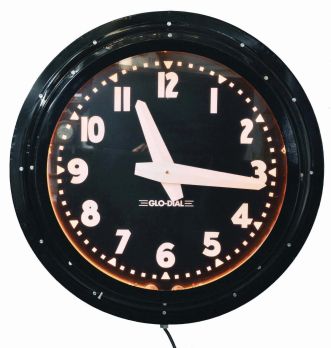 Glo-Dial Clock Company, Los Angeles, California, neon gallery wall clock, electric driven, time only movement with large 25.5in black dial, bold straight white hands, Arabic numerals and orange lighted neon perimeter