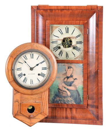 Clocks- 2 (Two) American Wood Case: (1) Dilger & Co., ogee clock, 30 hour, time and strike, weight driven in a walnut veneer case with painted wooden dial; (2) Seth Thomas Clock Co.,Thomaston Conn., "Drop Octagon 8 Inch", 8 day, time and strike, spring driven movement in an oak case with painted metal dial, c1928.