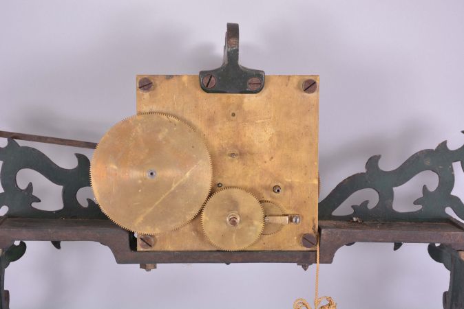 Huntington & Platts, Ithaca, New York (attribution), partial calendar clock, green painted cast iron frame, movement and reverse painted glass dial.