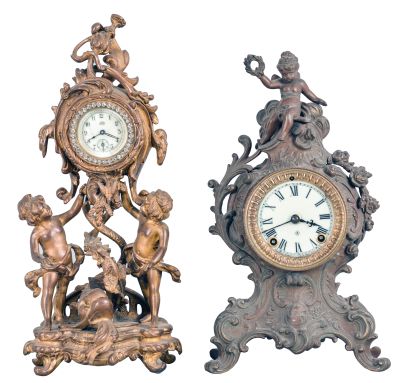 Clocks- 2 (Two): (1) Waterbury Clock Co., Waterbury, Conn., 30 hour, spring brass lever movement figural timepiece with brilliant surround dial, c1900; (2) Ansonia Clock Co., New York, "Cygnet", 8 day, time and strike, spring brass movement cast metal case with a figure on top mantel clock, c1904.