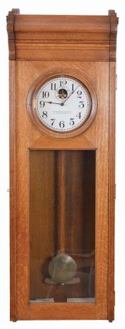 Standard Electric Time Co., Springfield, Mass., "Master Clock" wall clock, electrically driven, time only movement producing electrical impulse to drive a slave or slaves, one of which is included. The clock is housed in a heavy oak case and has painted metal dial.