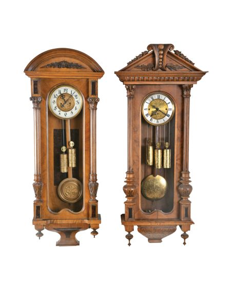 Clocks- 2 (Two) Vienna Regulators, engraved brass weights and pendulum, in carved walnut cases: (1) two weight, time and strike; (2) three weight, grand sonnerie