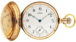 American Waltham Watch Co.,Waltham, Mass., "Amn. Waltham Watch Co.", model 1874, 14 size, 15 jewels, stem wind and lever set, adjusted, damascened nickel plate movement with lever escapement, cut bimetallic balance, gold timing screws and Woerd micrometric regulator in a 14 karat, rose gold hunting case, the front cover with engraved cipher, and rear with engraved crest, Arabic numeral, outer red 5-minute markers, single sunk white enamel dial, blued steel Breguet style hands, serial #2120542, 97.7g TW, c1885.