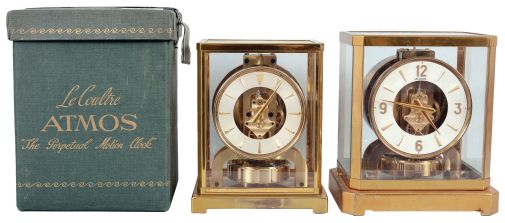 Clocks- 2 (Two) Atmos: (1) Jaeger-LeCoultre, Switzerland, "Atmos" clock, 15 jewel, caliber 526-5 movement, torsion pendulum, round metal dial with applied gilt arrow markers, gilt hands, all contained in a rectangular case with original cloth covered box, serial #83408, c1955; (2) Jaeger-LeCoultre, Switzerland, "Atmos" clock, 15 jewel movement, torsion pendulum, round metal dial with applied gilt numerals, arrow markers, and hands.