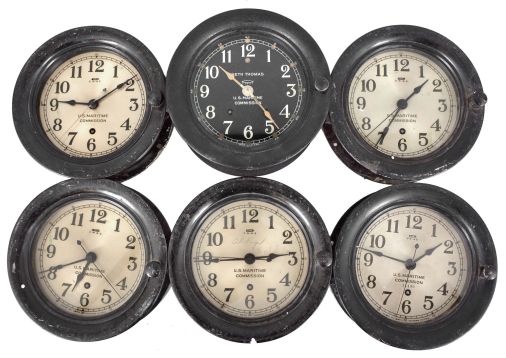 Clocks- 6 (Six) Seth Thomas Marine Clocks: Seth Thomas Clock Co., Thomaston, Conn., for U.S. Maritime Commission, five being 8 day, time only wardroom or engine room clocks with center seconds on 5.5 inch silvered dials in black phenolic cases with hinged bezels, the last being a time and ship