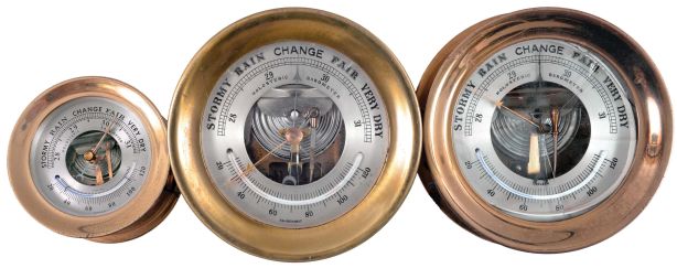 Barometers- 3 (Three) Marine Barometers: two signed by Chelsea Clock Co., Boston, Mass., holosteric barometers in brass cases with silvered dials and alcohol thermometers.