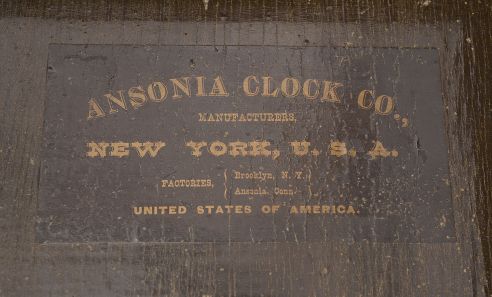 Ansonia Clock Co., New York, "Regulator A" wall clock, 8 day, time and strike, spring driven movement in a walnut case with paper dial with subsidiary seconds and blued steel hands.